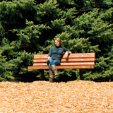 Rainbow Play Village Commercial Bench with cedar seating and powder-coated steel supports installed at a commercial playground, park, school, church, or recreation facility in North Carolina.